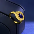 Close-up of vintage gold ring featuring a deep blue oval lapis lazuli gemstone inlay - Gold Lapis Lazuli Ring