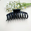 Large black silicone hair claw clip in a sleek matte finish for thick hair styling - Soft Silicone Bone Black