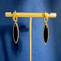 Pendientes vintage dorados con gota negra mostrados en un soporte de joyería - Pendientes de Gota de Agua / Color Ágata Negra