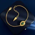 Golden bracelet with green malachite oval stone and stylish cone-shaped pendant - Gold Malachite Bracelet