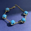 Adjustable golden chain bracelet with five sky blue sugarloaf cut crystal gemstones - Gold (Turquoise + Clear)