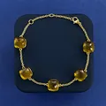 Minimalist gold chain bracelet featuring five cushion-cut yellow crystal gemstones - Gold and Olive Green
