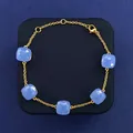 Minimalist gold chain bracelet featuring five square sky blue crystal gemstones - Gold Tone + Blue Jade