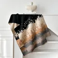 Winter faux cashmere scarf with abstract print and tassels on a minimalist mantle - Black