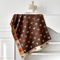 Close-up of double-sided bee pattern scarf with fringe and soft cashmere-like texture - 185x65cm / Brown