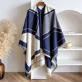 Detail of navy and beige geometric knit shawl with fringed edges and dashed embroidery - Blue