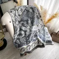 Elegant grey and blue paisley embroidered long shawl with tassel fringe on sofa - 185x65cm / Gray