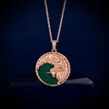 Detail of rose gold zodiac coin necklace with green malachite and unicorn relief - Virgo