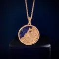 Macro shot of rose gold koi fish relief pendant with blue gemstone inlay detail - Pisces