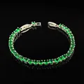 Detailed view of silver tennis bracelet with green round-cut cubic zirconia and claw setting - Silver Green