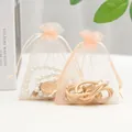 Peach organza drawstring jewelry pouches with pearl necklaces in a light aesthetic setting - 5*7cm / Champagne