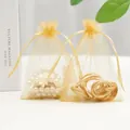 Golden organza jewelry gift bags with drawstring featuring pearls and gold chains - 5*7cm / Gold