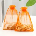 Set of two orange organza drawstring bags for jewelry packaging with silk ribbons - Orange