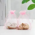 Pink sheer organza drawstring gift bag for jewelry storage with a delicate ribbon closure - Pink