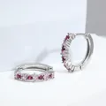 Detail of silver huggie earrings featuring alternating red and pink round zircons - Rose Red Zirconia / Silver