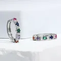 Macro detail of silver huggie hoop earrings with multi-color square-cut zircons - Silver + Multicolor