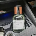 Car aromatherapy bottle with wood grain lid and transparent glass in cup holder - Car Encounter