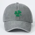 Classic grey cotton baseball cap featuring green clover embroidery on a white background - One Size / Gray