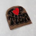 Detail of Top Tier lettering and red broken heart knitting on the brown Y2K beanie - Brown