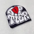 Flat lay of a Y2K style beanie featuring white TOP TIER jacquard text and a red broken heart - Navy Blue