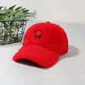 Plush red winter baseball cap with black alien embroidery on a minimalist gray background - Red