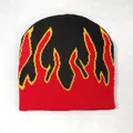 Knitted beanie hat featuring a bold red and yellow flame pattern on a black base - One Size / Black