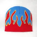 Knitted beanie hat with red and blue contrast and yellow flame pattern design - One Size / Sapphire Blue