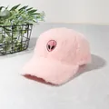 Detail of pink plush baseball cap featuring a fuzzy texture and alien head embroidery - Pink