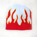 Light blue and red knitted beanie featuring a vibrant yellow-bordered flame pattern - One Size / Light Blue