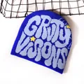 Navy blue beanie with grey GRVY VISIONS text and yellow stars on a white surface - One Size / Sapphire Blue