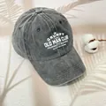 Washed dark gray baseball cap featuring white Grumpy Old Man Club text embroidery - One Size / Gray