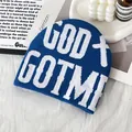 Dark blue knit beanie with white GOD GOT ME lettering and cross pattern in streetwear style - One Size / Blue