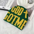 Green knit beanie with yellow GOD GOT ME text and cross on soft white fabric - One Size / Dark Green