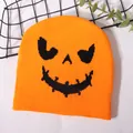 Orange knitted Halloween beanie with a black Jack-o'-lantern pumpkin face pattern - One Size / Orange