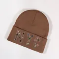 Brown knit beanie featuring vibrant NYC colorful rhinestone lettering for winter style - Coffee