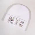 White knitted beanie featuring colorful rhinestone NYC letters with a cozy texture - White