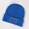 Royal blue knitted beanie with sparkling rhinestone eagle design and folded cuff - Blue