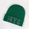 Forest green ribbed knit beanie featuring sparkling NYC rhinestone embellishments - Dark Green