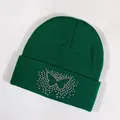 Dark green knitted beanie featuring a colorful rhinestone butterfly embellishment - Dark Green