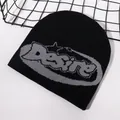 Black knit beanie hat featuring gray Desire jacquard lettering in a street fashion style - Black/Grey