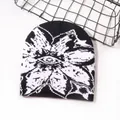 Streetwear jacquard knit beanie with white floral patterns on black background - One Size / Black and White
