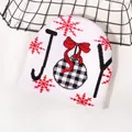 White Christmas knitted beanie featuring JOY text with red snowflake and bow patterns - JOY Sign