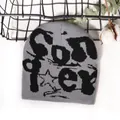 Grey and black knit beanie featuring stylish jacquard patterns for a street fashion look - One Size / Gray