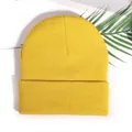 Classic yellow ribbed knit beanie hat with a wide fold-over cuff and stretchy acrylic fabric - Turmeric