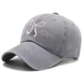 Washed grey denim baseball cap featuring a delicate pink ribbon bow embroidery - One Size / Gray