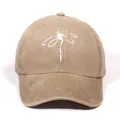 Washed khaki cotton baseball cap featuring minimalist white dragonfly embroidery design - Khaki