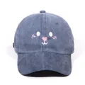 Navy blue washed denim baseball cap featuring a cute cartoon face embroidery - Navy Blue