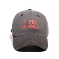 Washed dark grey baseball cap with red 'I PEE IN POOLS' printed lettering - Black