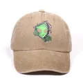 Washed khaki denim baseball cap featuring a green alien head embroidery design - Khaki