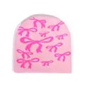 Stylish light pink knitted beanie with fuchsia bow jacquard pattern for women - One Size / Light Pink